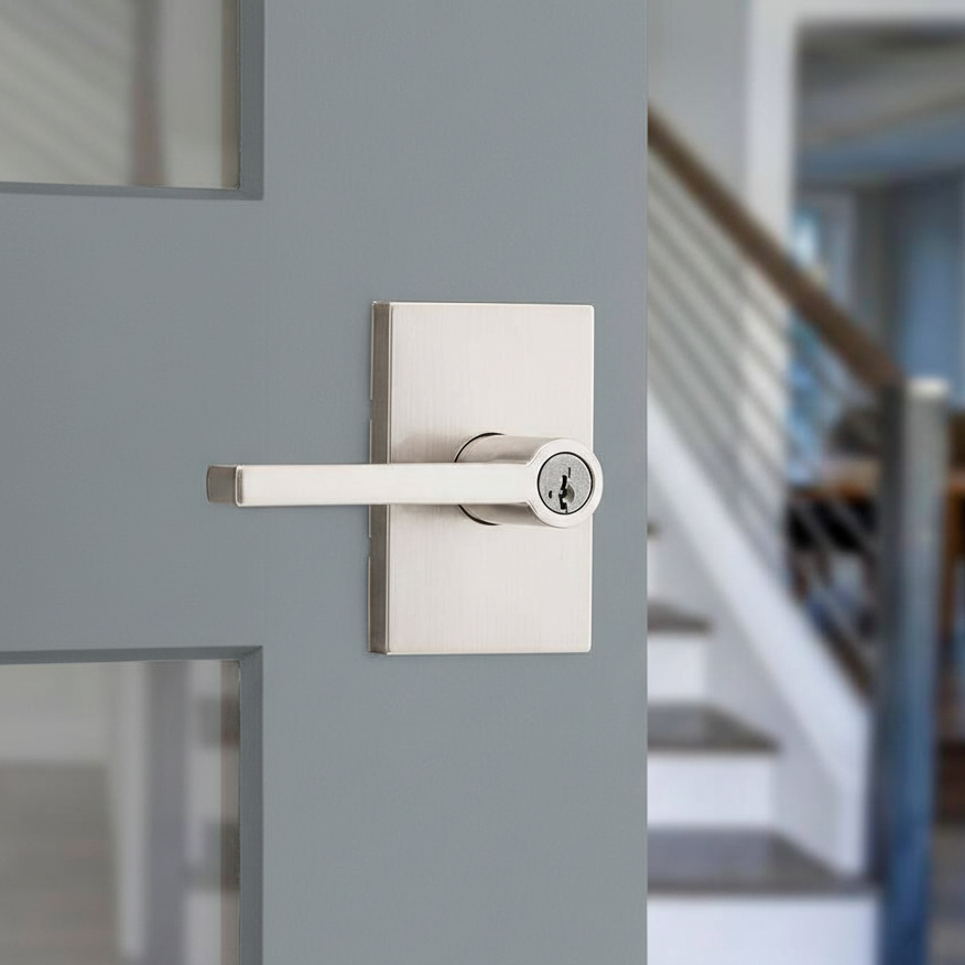 Kwikset satin nickel lever handle with square rosette on an interior door